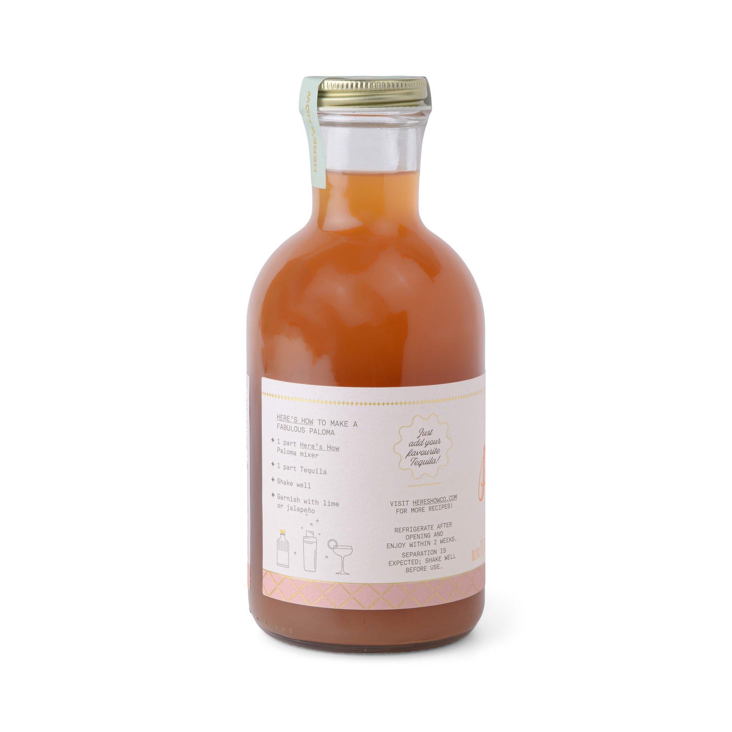 A glass bottle filled with orange liquid features a light-colored label displaying the Paloma product name along with cocktail recipe instructions and ingredients.
