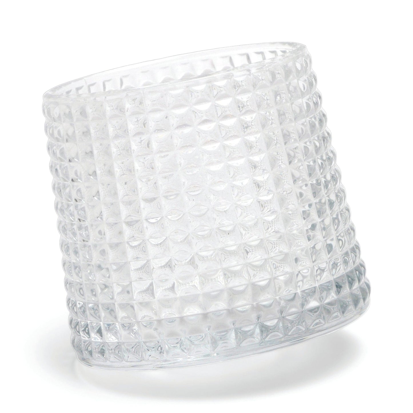 The Lola textured clear glass tumbler with a spherical bottom design lies on its side against a white background.