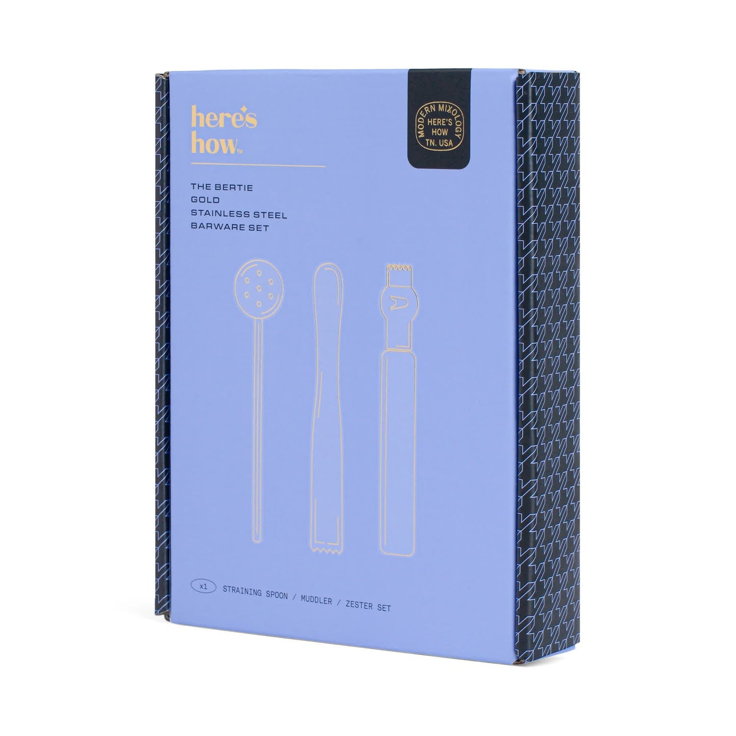 A blue box labeled heres how. holds The Bertie Barware Set, a gold stainless steel collection ideal for cocktail lovers, with illustrations of a straining spoon, muddler, and zester on the front.