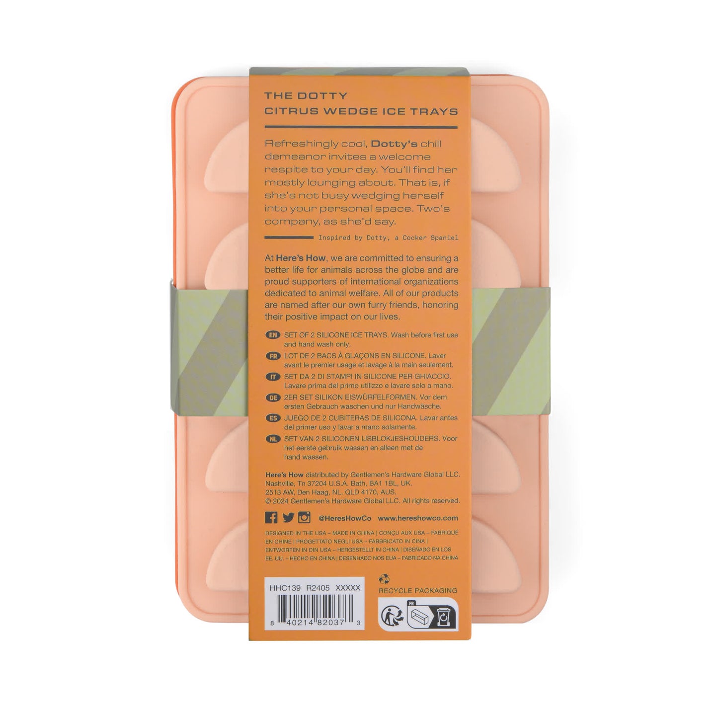The Dotty Citrus Wedge Ice Trays are peach-colored with a playful design. Each tray includes a cardboard sleeve featuring product details, usage instructions, and eco-friendly highlights. Great for making fun citrus-shaped ice cubes!.