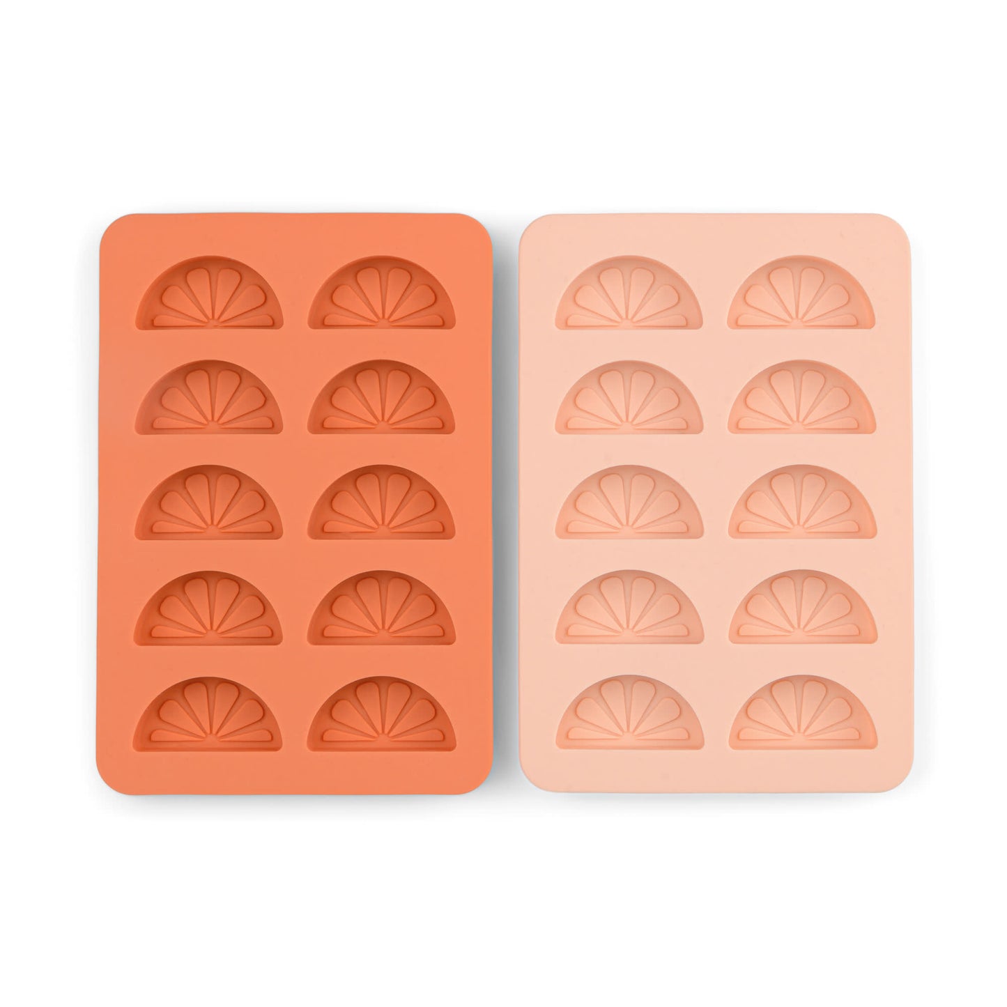 The Dotty Citrus Wedge Ice Trays, one orange and one light pink, each with six citrus wedge-shaped cavities, add a playful touch to your drinks by making fun ice cubes.