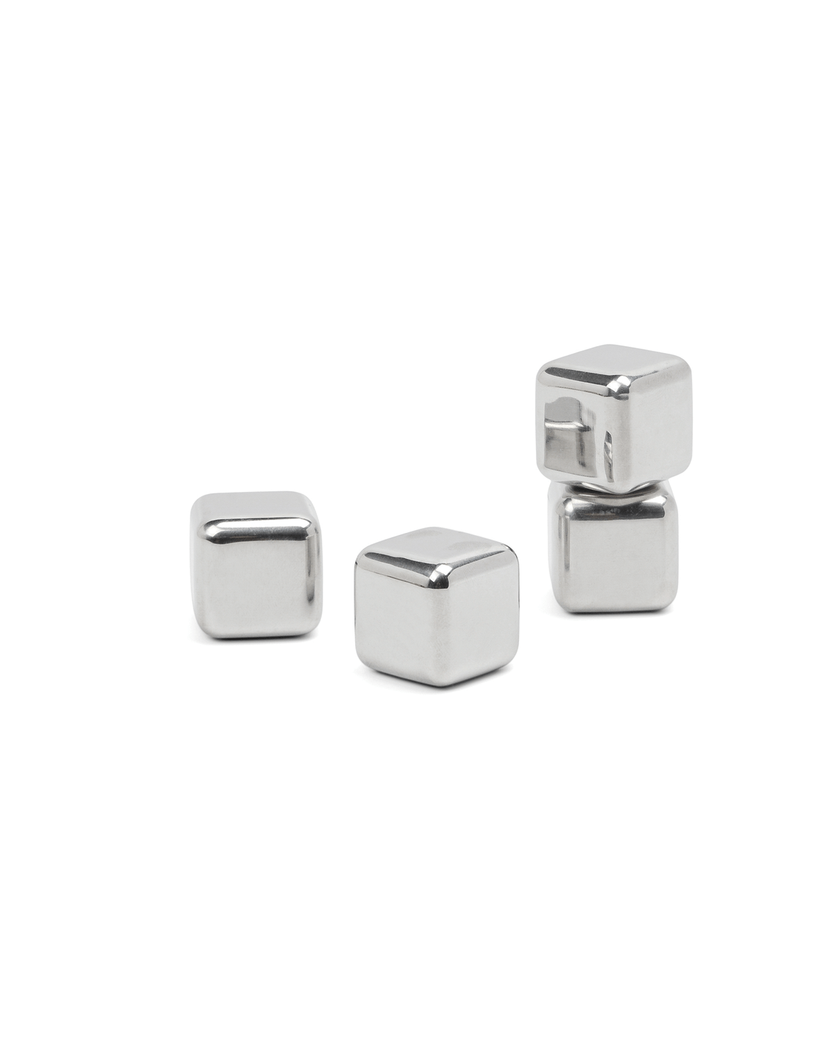 Four Ruby Cubes—stainless-steel, freezable cocktail chillers—three side by side and one stacked, keep drinks cold without dilution on a plain white background.
