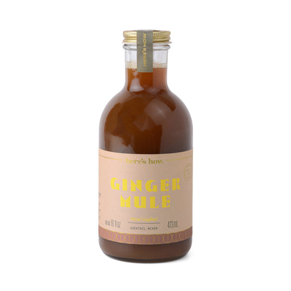 A 473 mL glass bottle of Ginger Mule cocktail mixer, featuring a metal cap and light brown liquid inside—ideal for making your next Moscow Mule.