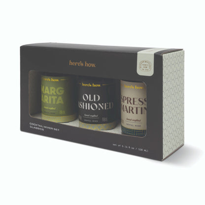 Here's how Cocktail Mixer Set Classics gift box containing three canisters: Margarita, Old Fashioned, and Espresso Martini, shown on a white background.