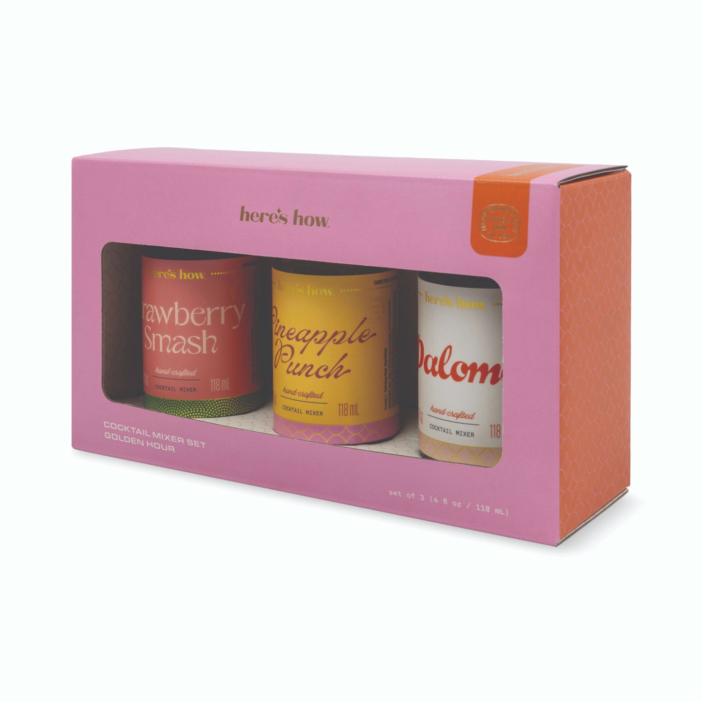 A pink gift box containing three can-shaped bottles labeled Here's How, Strawberry Smash, Pineapple Punch, and Palom, shown on a clean white background.