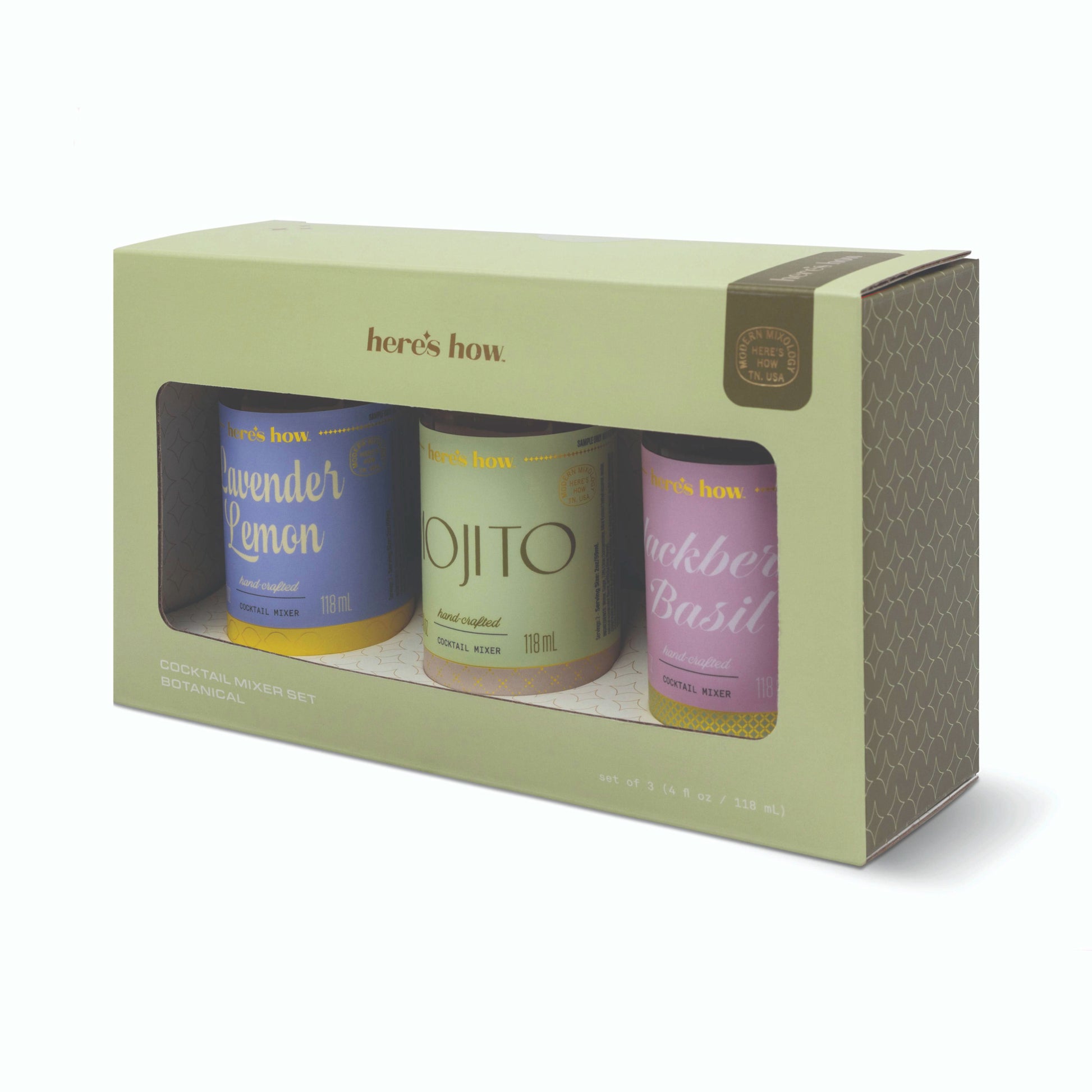 Three small bottles of different flavors in a 'here's how' branded box on a white background