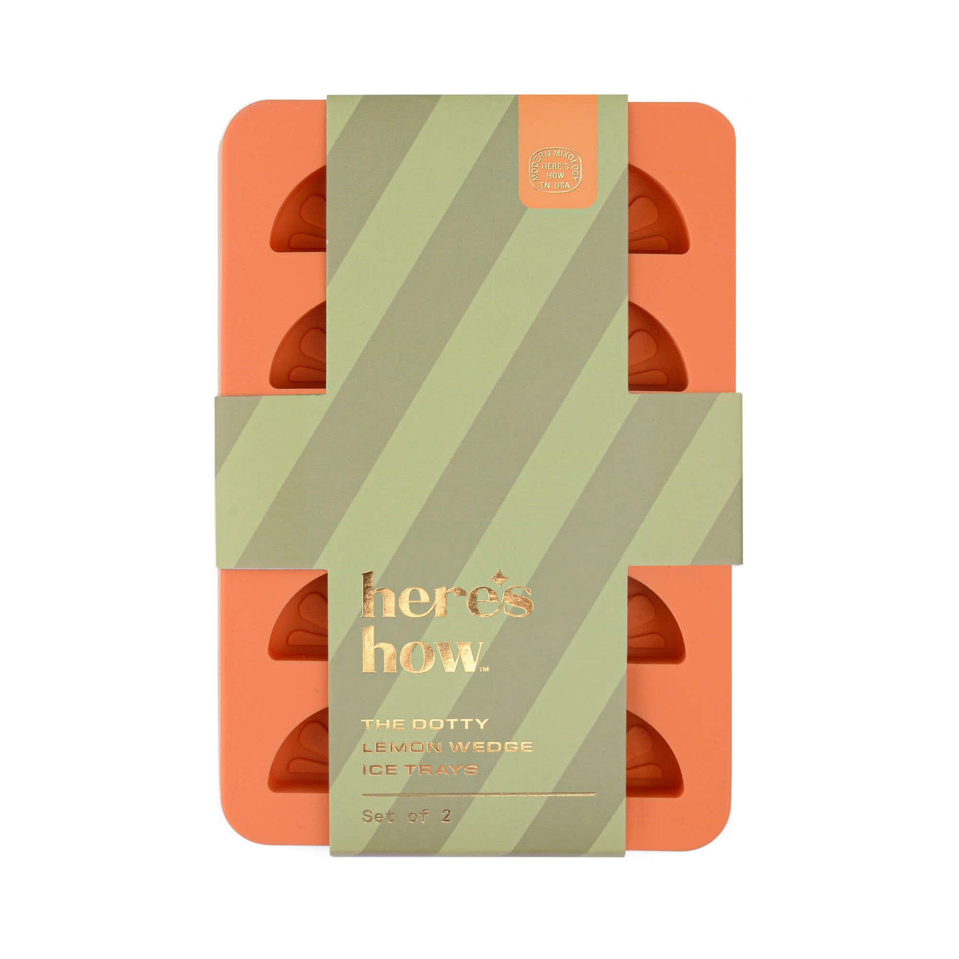 An orange silicone ice trays set with a green and gold here’s how label, The Dotty Citrus Wedge Ice Trays (set of 2) adds a playful touch to your drinks by creating perfectly shaped citrus wedge ice cubes.