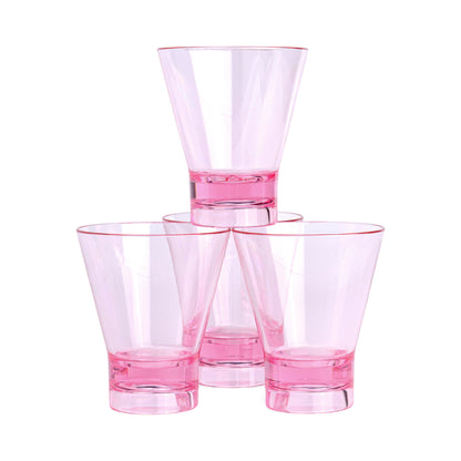 Four transparent The Gilda Tumbler glasses with pink bases are stacked in a pyramid against a white background, ideal for serving cocktails at your next beach gathering.