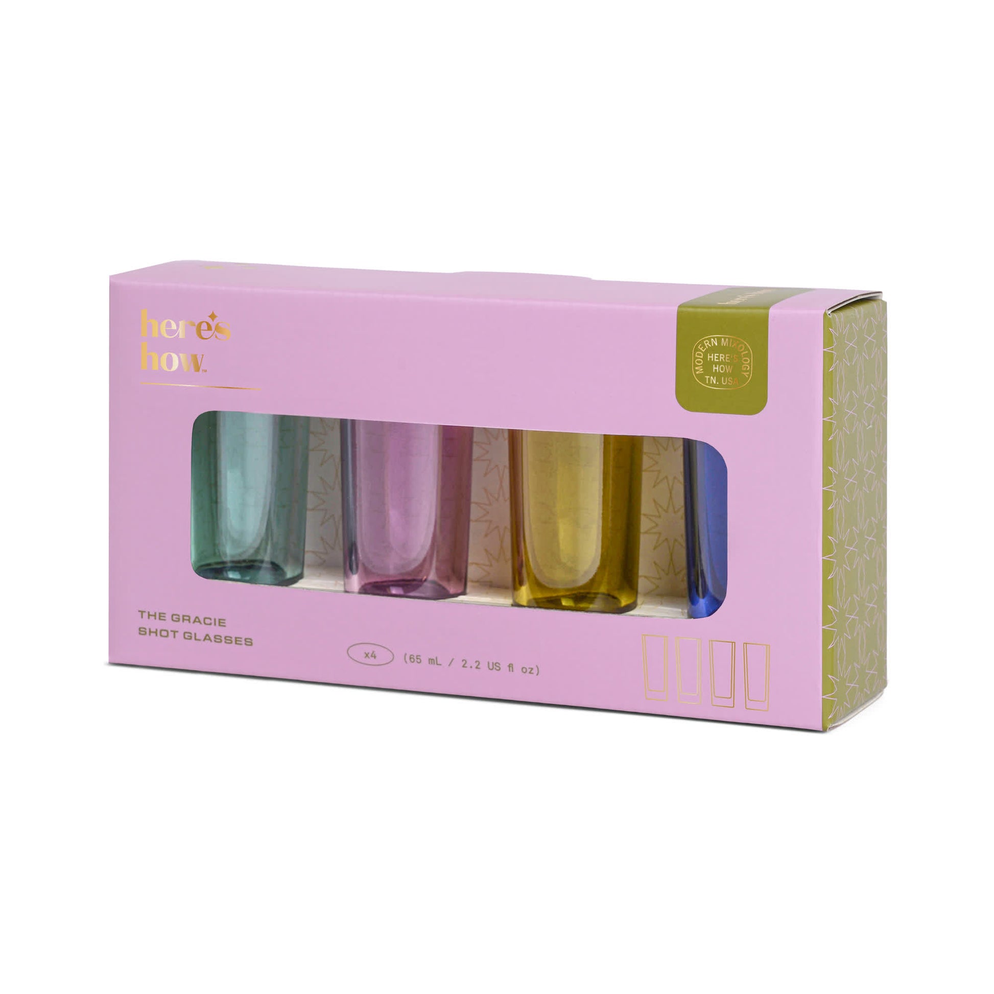 The Gracie Set Of 4 Shot Glasses features pink, blue, purple, and yellow glasses in a light purple heres how box—ideal for parties or celebrations.