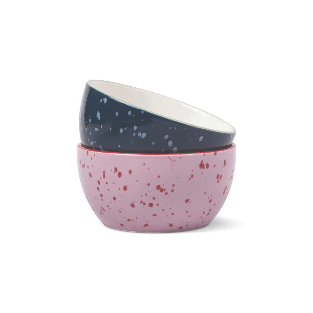 The Bella Ceramic Dipping Bowls - Navy + Lilac Splatter featuring two stacked bowls: a navy top bowl with white speckles and a lilac bottom bowl with red speckles.
